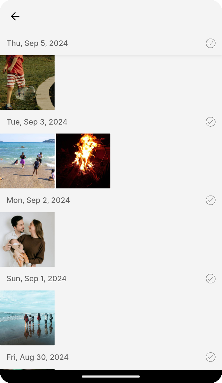 Gallery scrolled to the selected day with date headers on Ente Photos mobile
